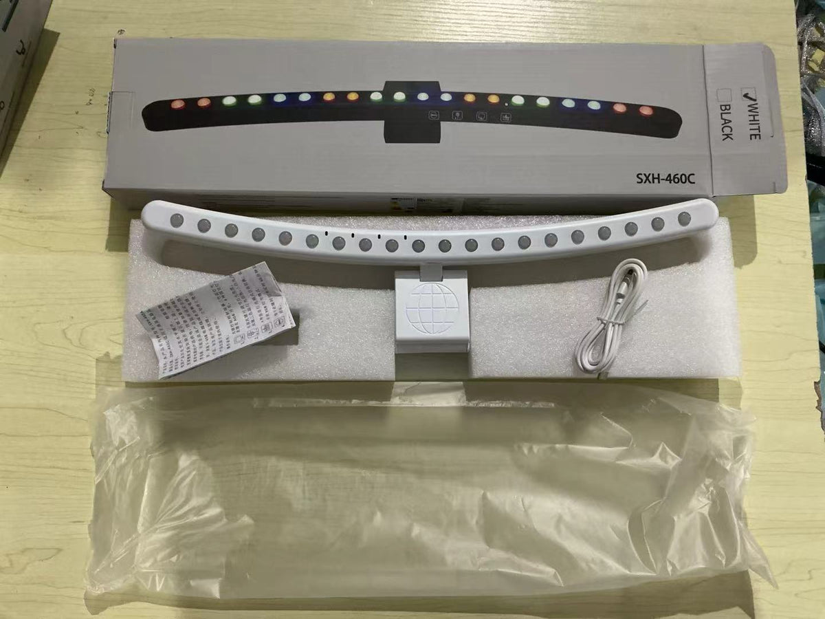 A hanging light on the computer monitor