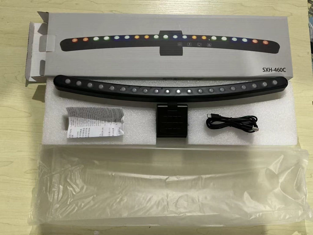 A hanging light on the computer monitor